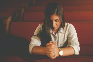 How to Create a Morning Prayer Routine That Works for You 2025 praying woman inside church