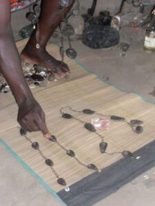 Priest Nduga performing African home cleansing ritual to attract luck